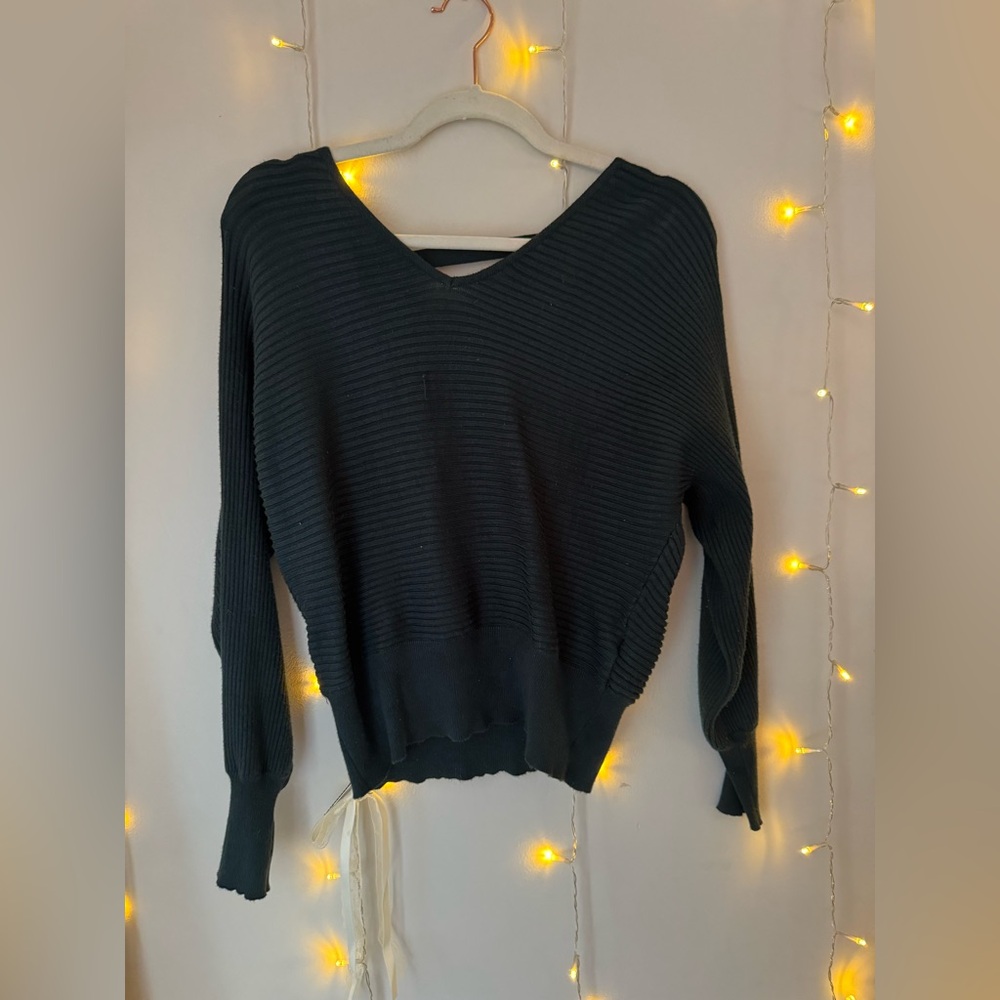 Dark green sweater, open back.
